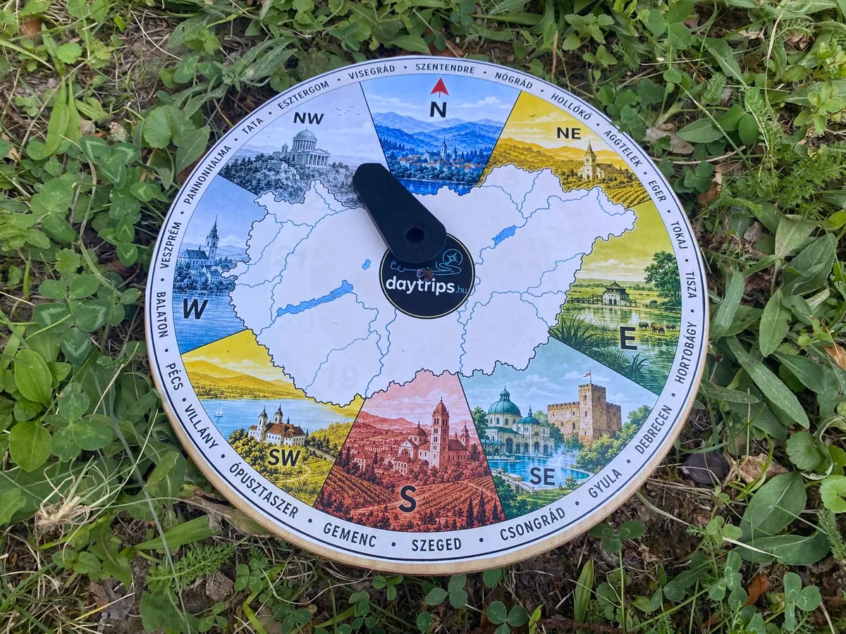 The daytrips spontrips compass lying in the grass